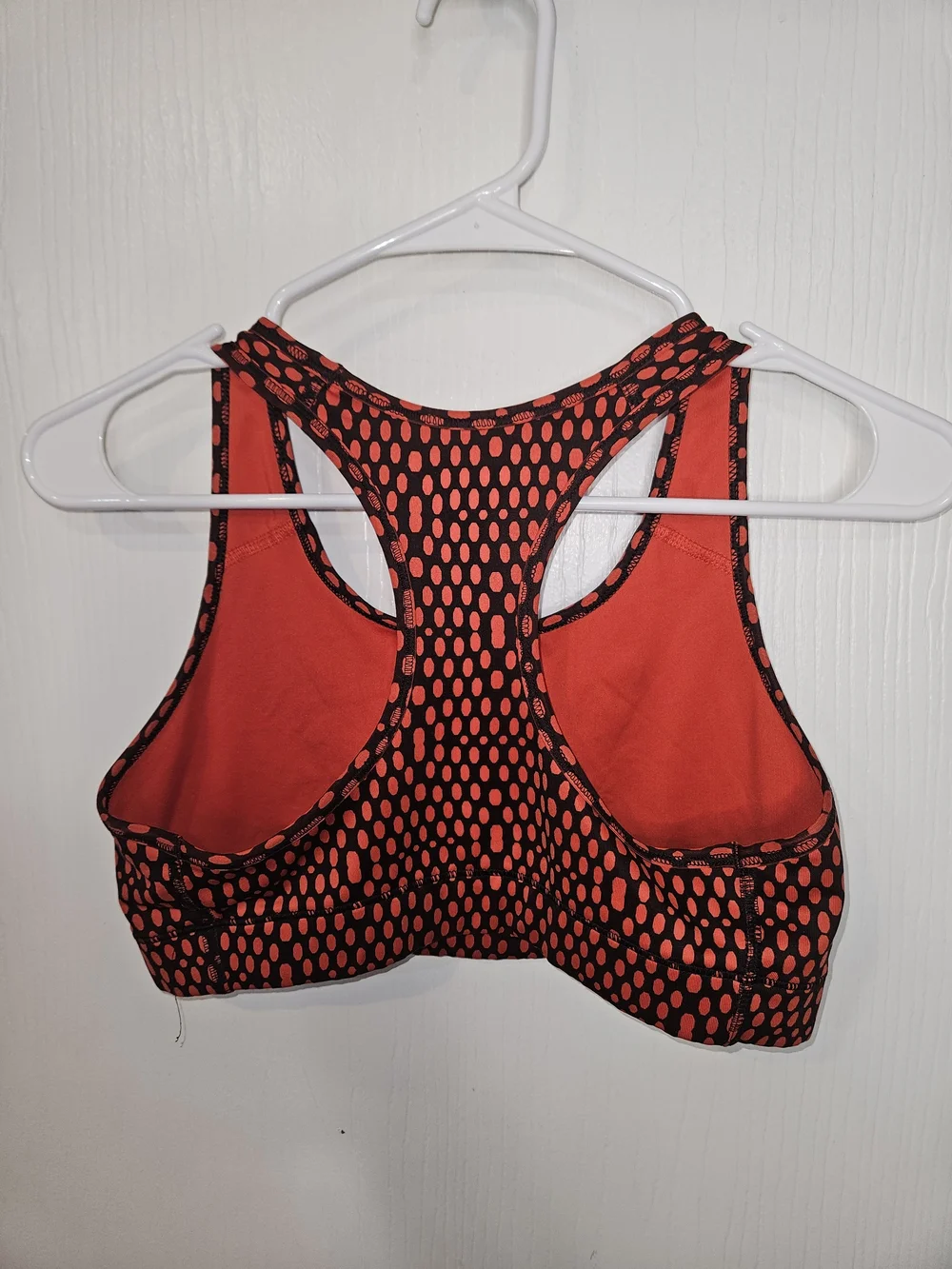 Nike Women's Red and Black Dotted Racerback Sports Bra